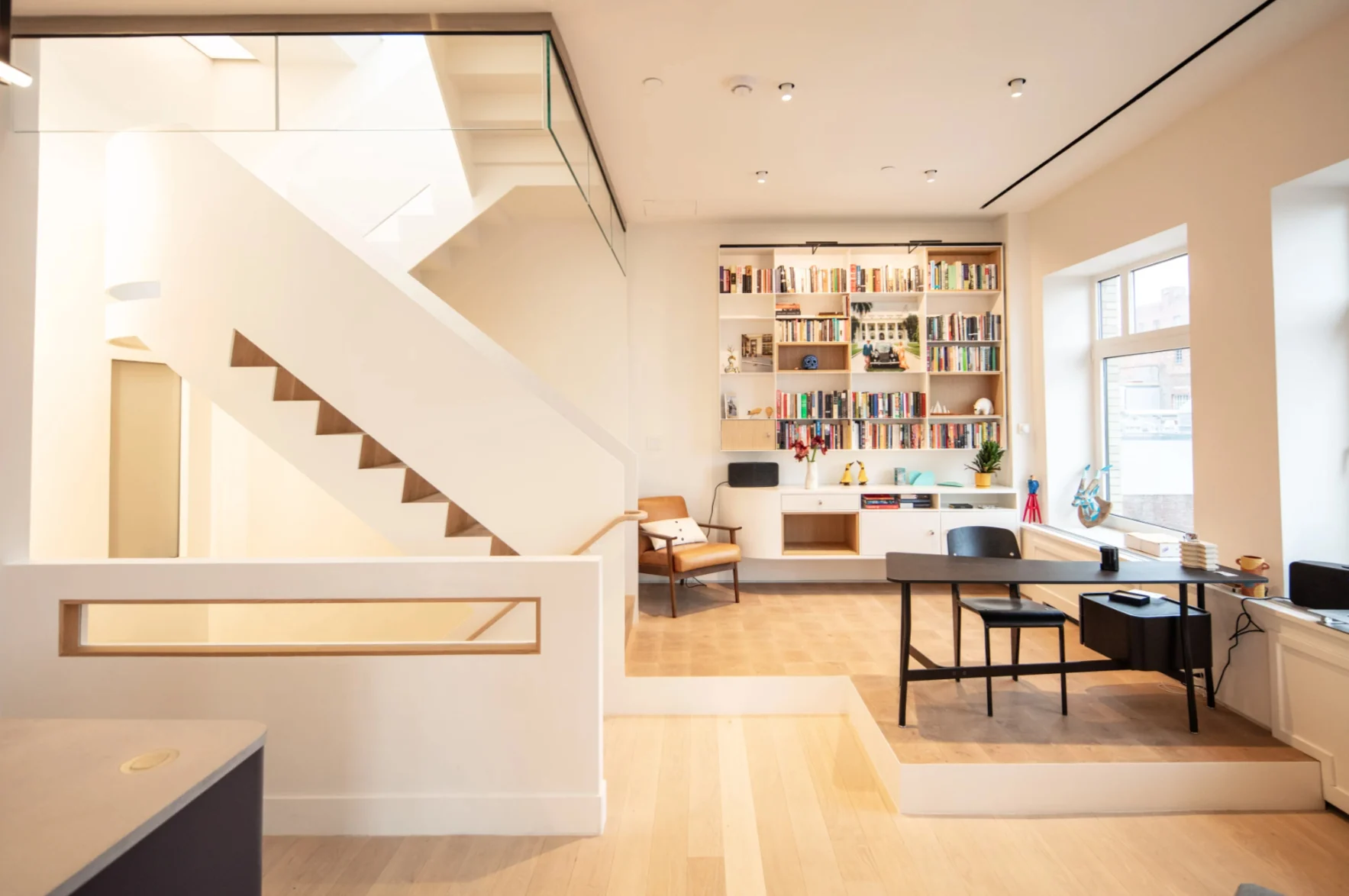 Finished East 4th Street residence with custom cabinetry, shelving and timber details